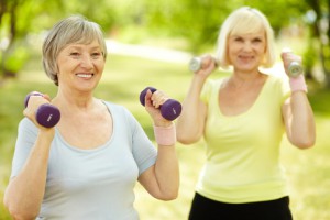 Ladies exercising outside with arm weights